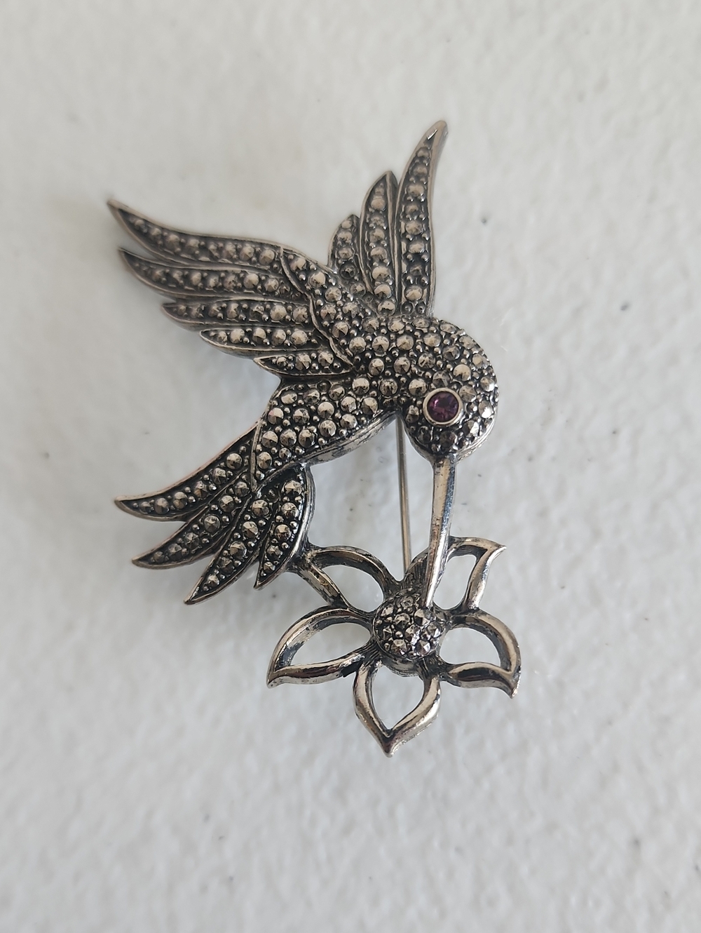 Source Unknown Silver Hummingbird Brooch with Purple Eye Accent